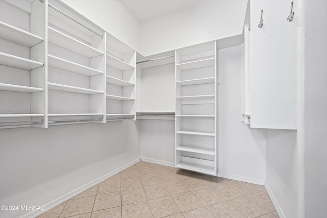 walk in closet featuring light tile patterned floors