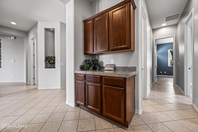 kitchen with recessed lighting, visible vents, and light tile patterned floors