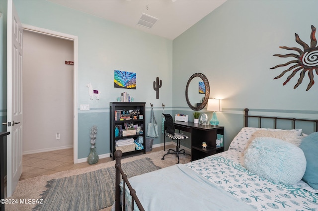 tiled bedroom with baseboards and visible vents