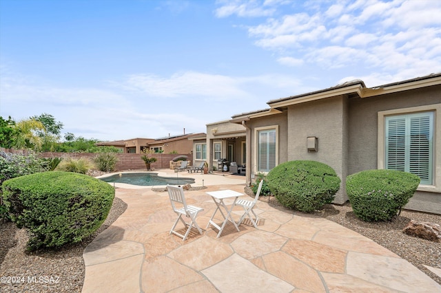 view of swimming pool with a fenced in pool, a patio area, and a fenced backyard