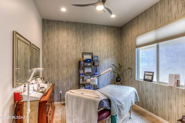 bedroom featuring a ceiling fan and baseboards