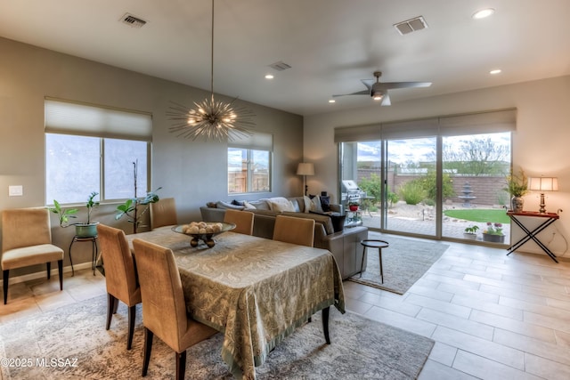 dining space featuring light tile patterned floors, visible vents, recessed lighting, and ceiling fan with notable chandelier