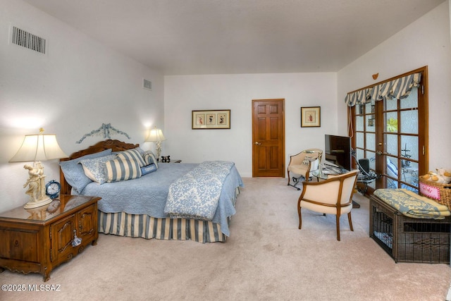 bedroom featuring light carpet, visible vents, and french doors