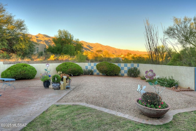 exterior space with fence private yard and a mountain view