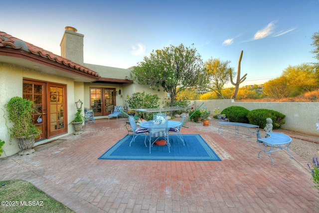 view of patio featuring outdoor dining area and french doors