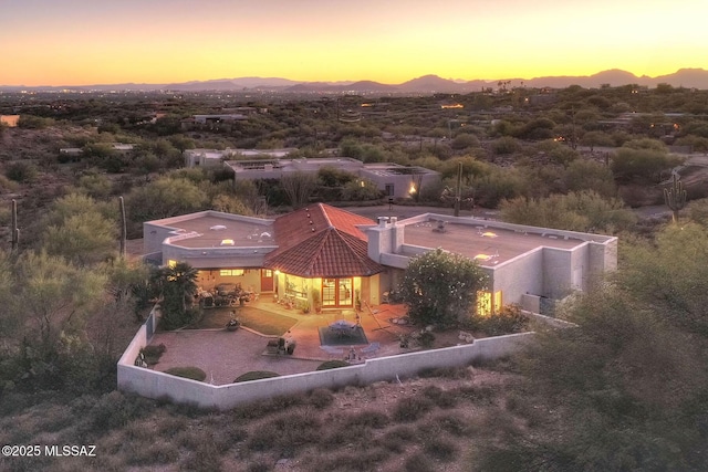 birds eye view of property with a mountain view