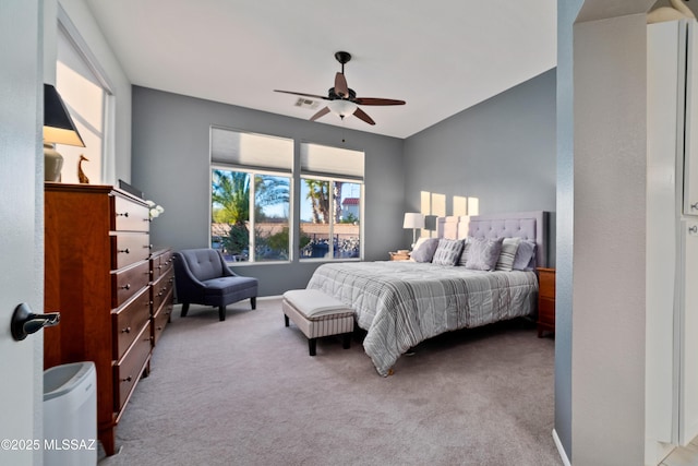 bedroom featuring ceiling fan, visible vents, and carpet flooring