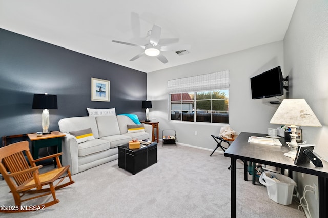 interior space with ceiling fan, visible vents, and baseboards