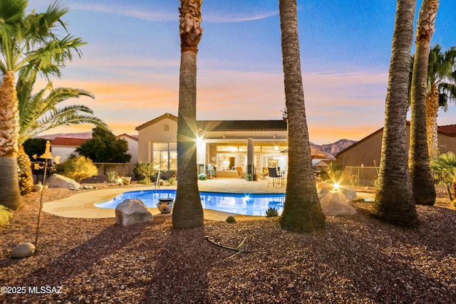 view of swimming pool featuring a patio area, a fenced backyard, and a fenced in pool