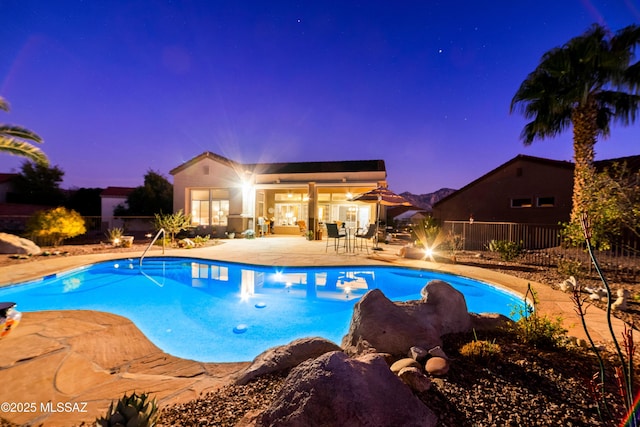 view of pool with a fenced in pool, a patio area, and fence