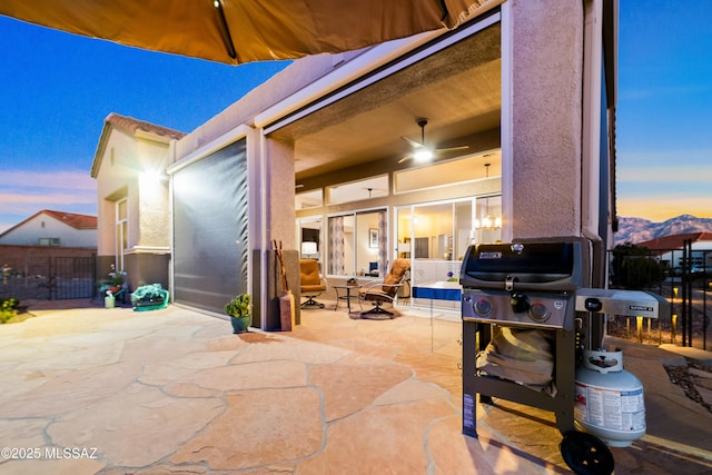 view of patio / terrace featuring a grill and fence