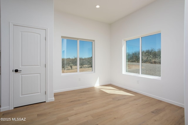 15809 N Twin Lakes Dr NW, Tucson, AZ 85739 - empty room featuring light wood-style flooring, baseboards, and recessed lighting