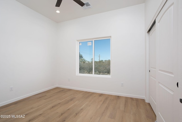 15809 N Twin Lakes Dr NW, Tucson, AZ 85739 - unfurnished bedroom featuring a closet, baseboards, visible vents, light wood-style floors, and recessed lighting