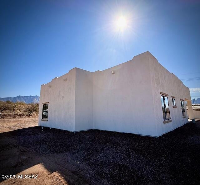 view of property exterior with stucco siding