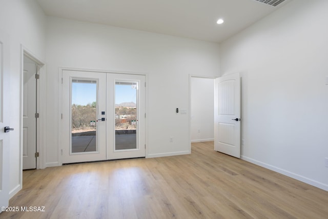 15809 N Twin Lakes Dr NW, Tucson, AZ 85739 - spare room featuring baseboards, visible vents, french doors, and light wood finished floors