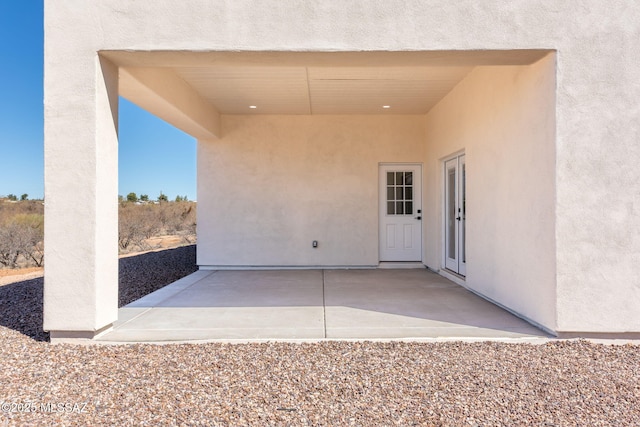 15809 N Twin Lakes Dr NW, Tucson, AZ 85739 - property entrance with stucco siding and a patio