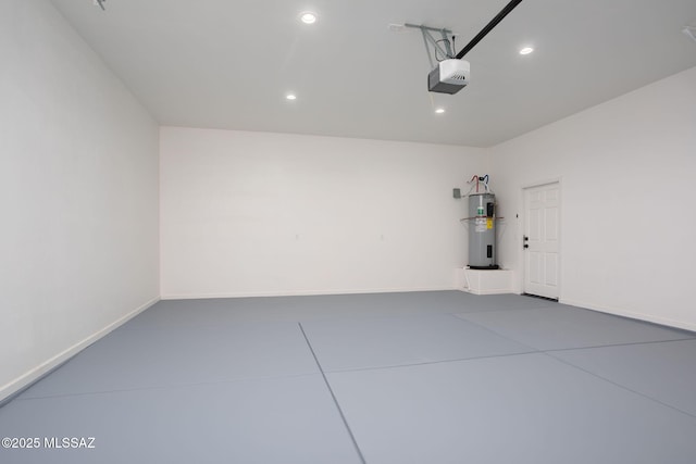 15809 N Twin Lakes Dr NW, Tucson, AZ 85739 - garage featuring recessed lighting, electric water heater, baseboards, and a garage door opener