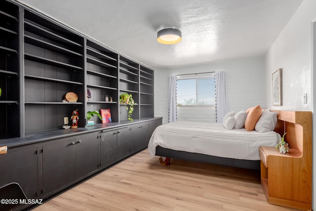 bedroom with light wood-style flooring