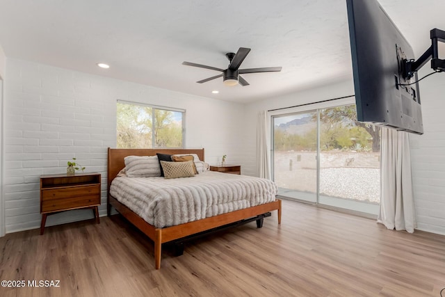 bedroom featuring access to exterior, recessed lighting, ceiling fan, and wood finished floors