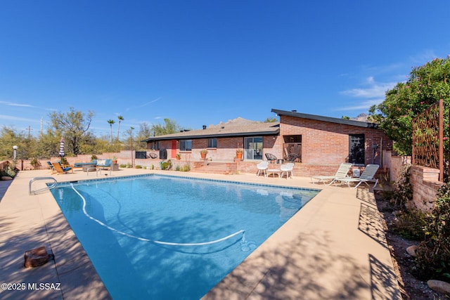 pool with a patio area