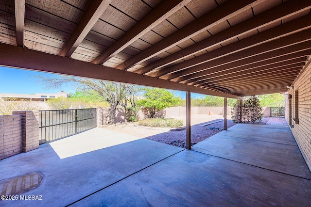 view of patio / terrace with a fenced backyard and a gate