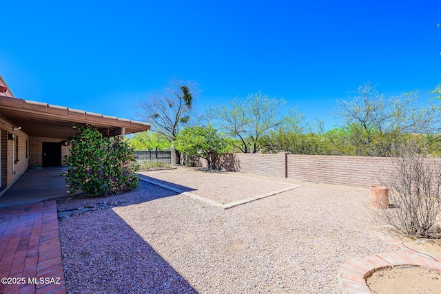 view of yard with a patio area and a fenced backyard