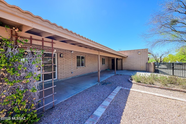 view of patio featuring fence