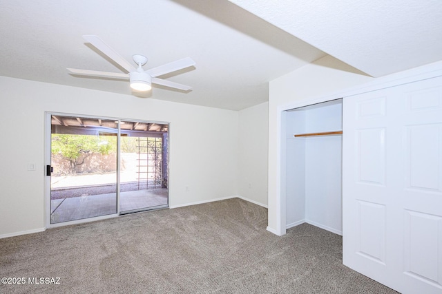 unfurnished bedroom with access to exterior, baseboards, carpet, a closet, and ceiling fan