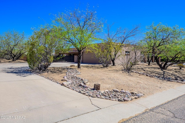 view of front of property with concrete driveway and an attached garage