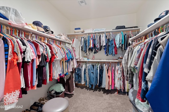 spacious closet featuring carpet and visible vents