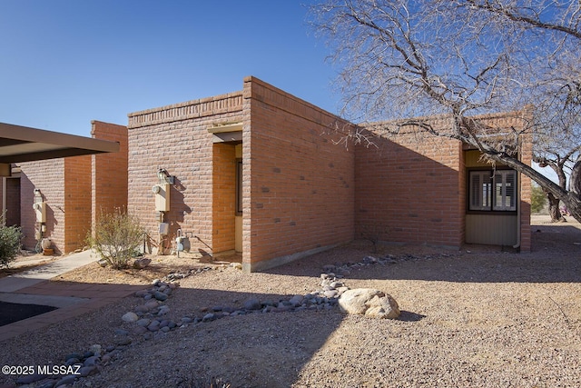 view of home's exterior featuring brick siding