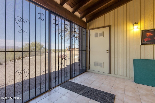 entrance to property featuring a gate and visible vents