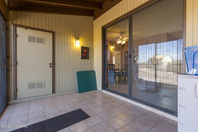 doorway to property featuring a patio area and visible vents