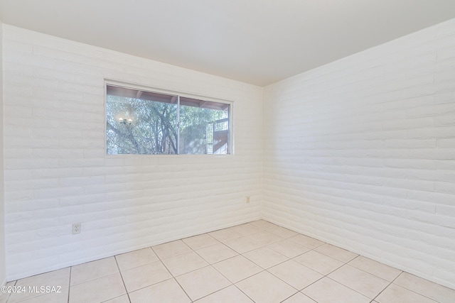 spare room featuring light tile patterned floors