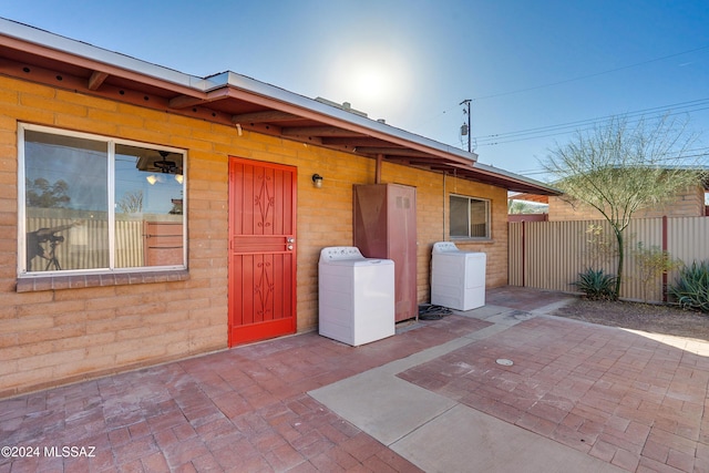 rear view of house featuring a patio area and fence