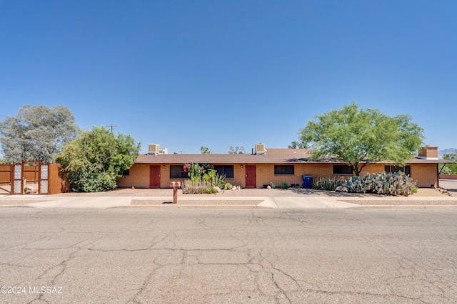 ranch-style home with fence