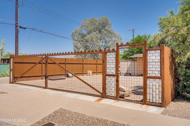 view of gate featuring fence