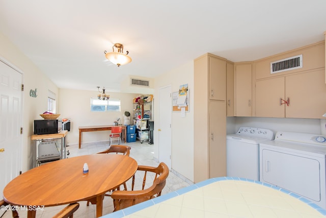 dining area with visible vents and washer and clothes dryer