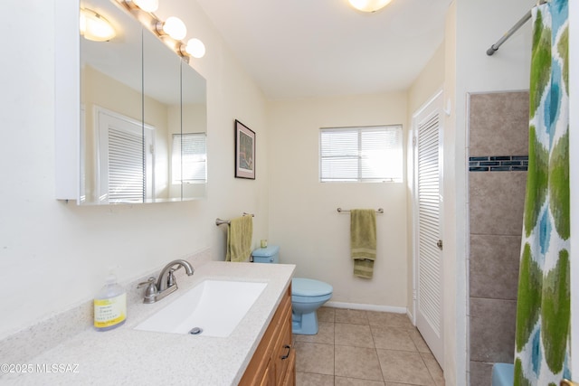 full bathroom with baseboards, toilet, a shower with curtain, tile patterned floors, and vanity