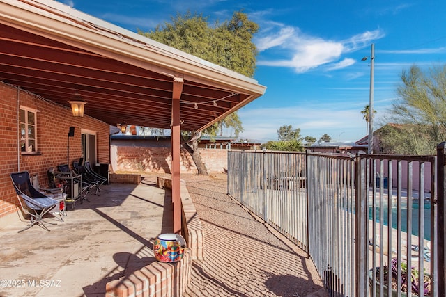 view of patio / terrace featuring fence