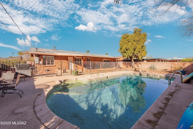 view of swimming pool with a fenced in pool, a patio, and fence