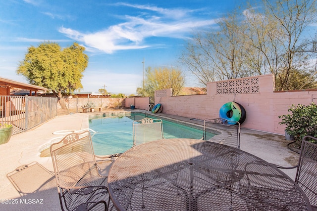 view of swimming pool featuring a patio area, a fenced backyard, and a fenced in pool