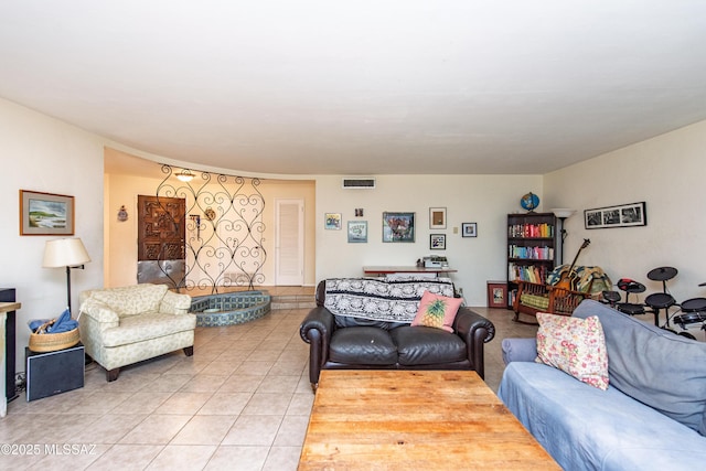 living area featuring visible vents and light tile patterned floors