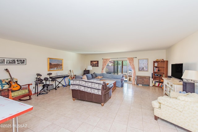 bedroom with access to outside and light tile patterned floors