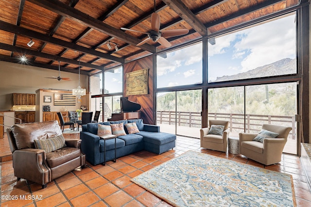 tiled living room with a wall of windows, wooden ceiling, a high ceiling, and beam ceiling