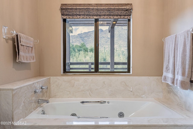 bathroom featuring a tub with jets