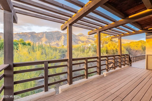 deck with a mountain view and a pergola