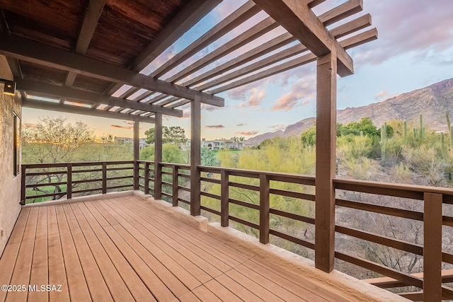 deck at dusk with a mountain view