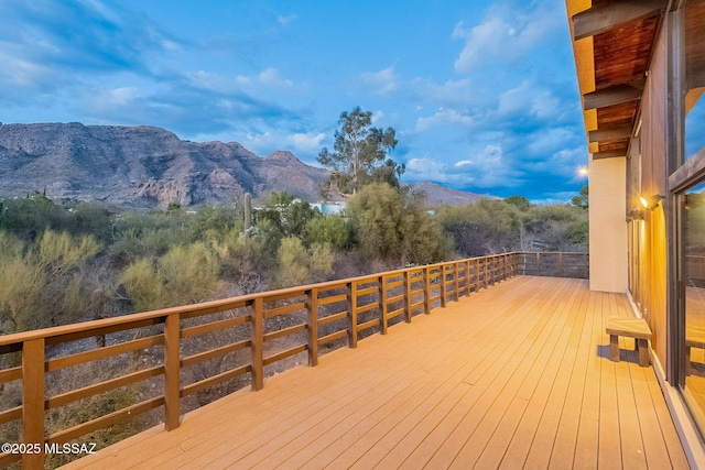 wooden deck featuring a mountain view