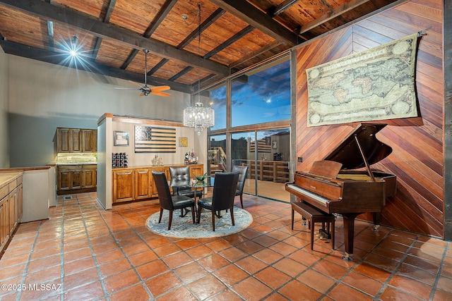 dining room with tile patterned floors, beam ceiling, high vaulted ceiling, and wooden ceiling